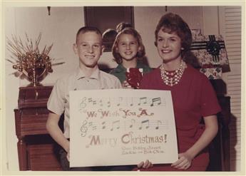 (CHRISTMAS TRADITION) A series of 24 photographs, following the Bob Okin Family over a period of 30 years as they pose for their annual
